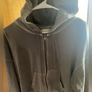 A cropped brown jacket and fit